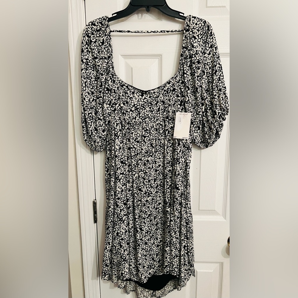 Boutique dress, fun, sexy, and comfortable. Size S. Open back. Never worn.